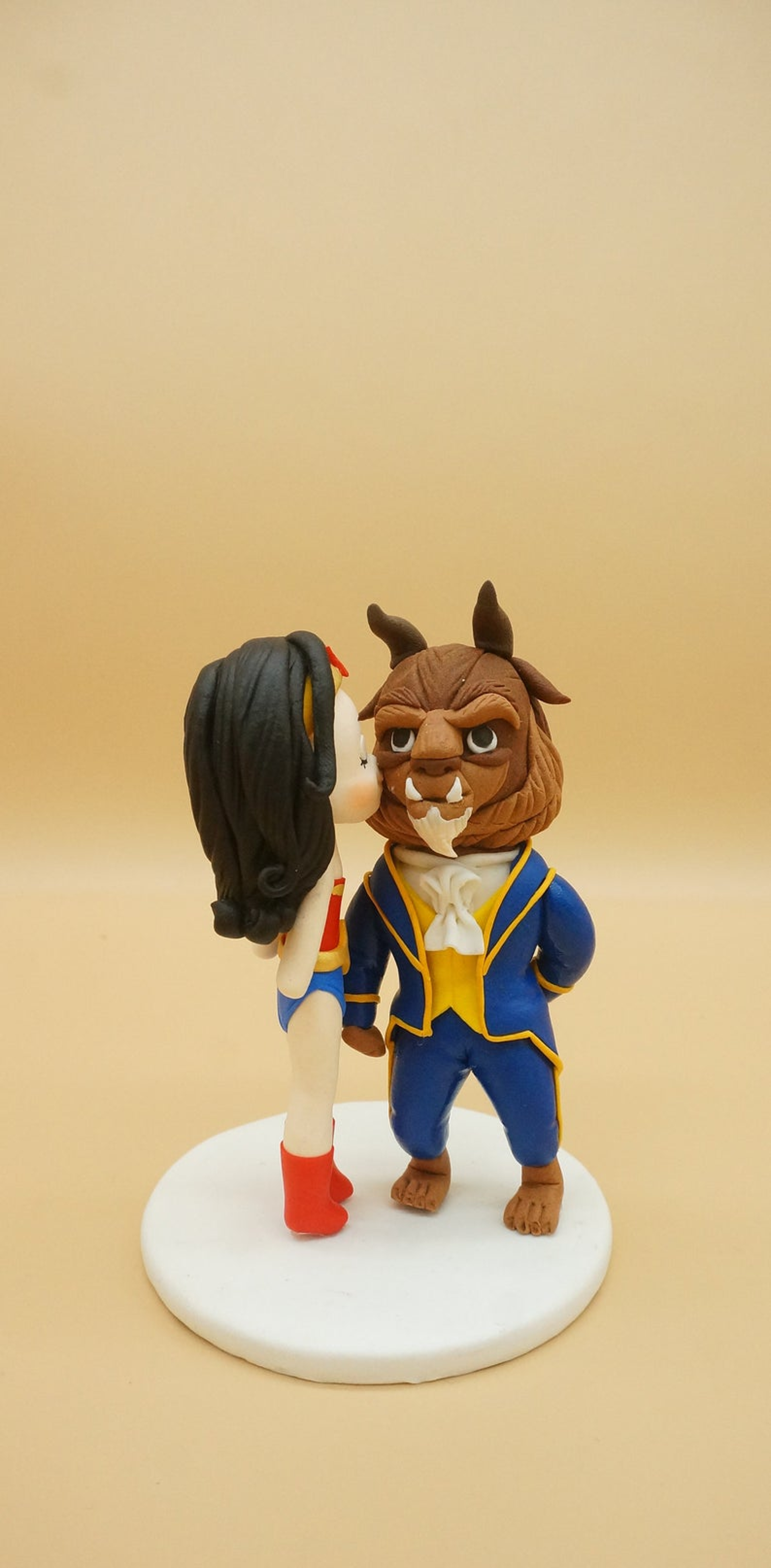 Picture of Wonder Woman and The Beast wedding cake topper