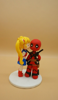 Picture of Sailor Moon and DeadPool wedding cake topper