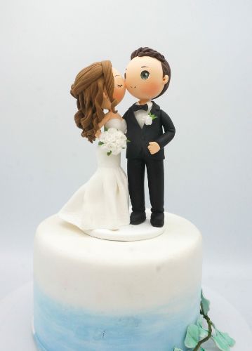 Picture of Cheek Kissing wedding cake topper, Bride kiss groom clay figurine
