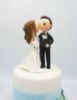 Picture of Cheek Kissing wedding cake topper, Bride kiss groom clay figurine