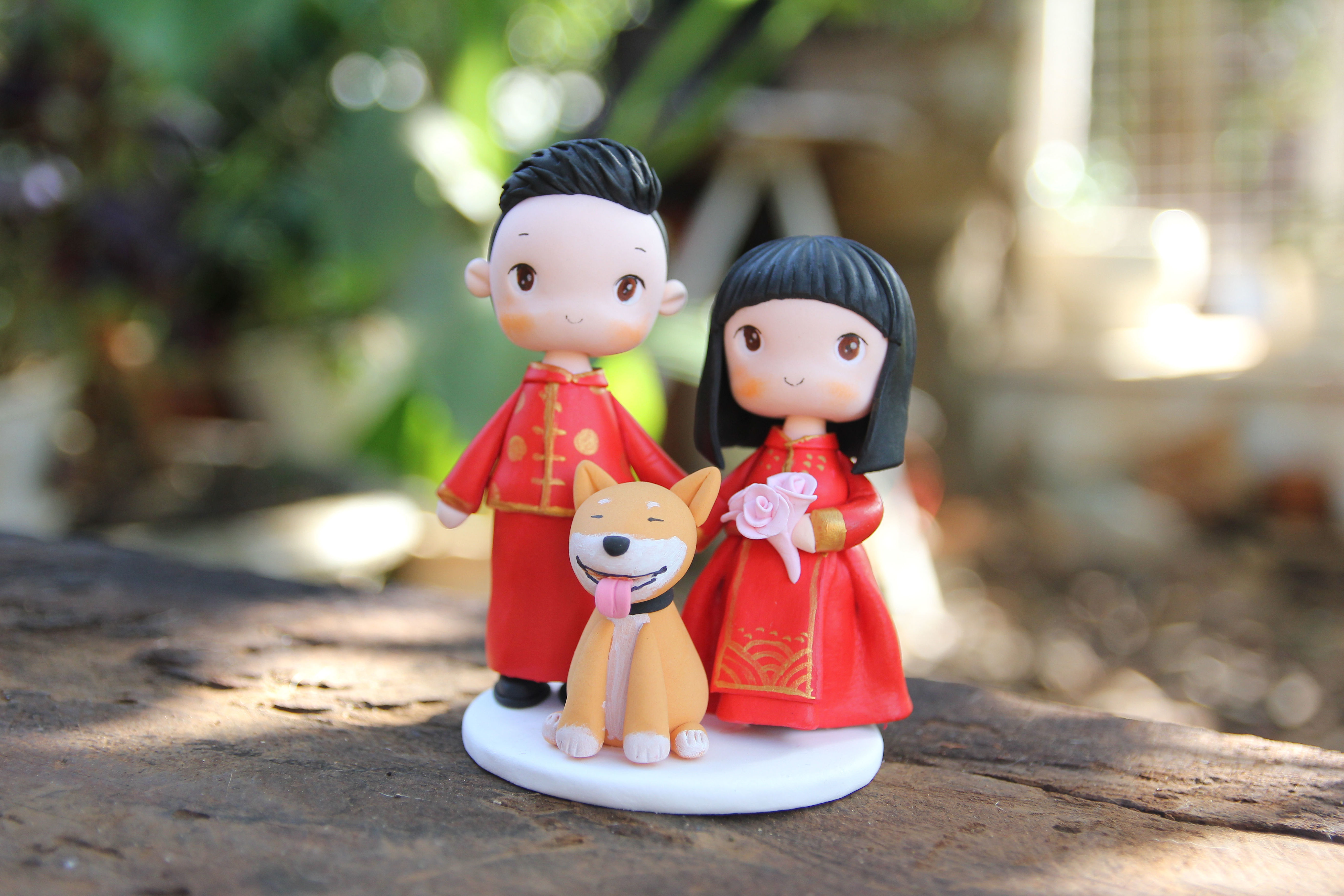 Picture of Chinese Wedding Cake Topper with Pet, Bride & Groom with Dog clay figurine