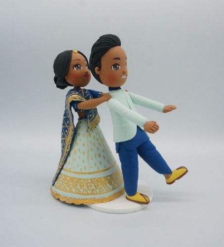 Picture of Bride Chasing Groom Wedding Cake Topper, Indian wedding cake topper