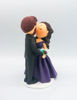 Picture of Kissing Bride & Groom cake topper,  purple theme wedding cake topper
