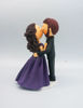 Picture of Kissing Bride & Groom cake topper,  purple theme wedding cake topper