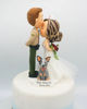 Picture of Police and Nurse with a dog wedding cake topper, Kissing forehead wedding cake topper