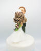 Picture of Police and Nurse with a dog wedding cake topper, Kissing forehead wedding cake topper