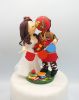 Picture of San Francisco 49ers fan groom & school teacher bride wedding cake topper