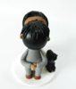 Picture of Ghana wedding cake topper, bride and groom wedding cake topper with dog