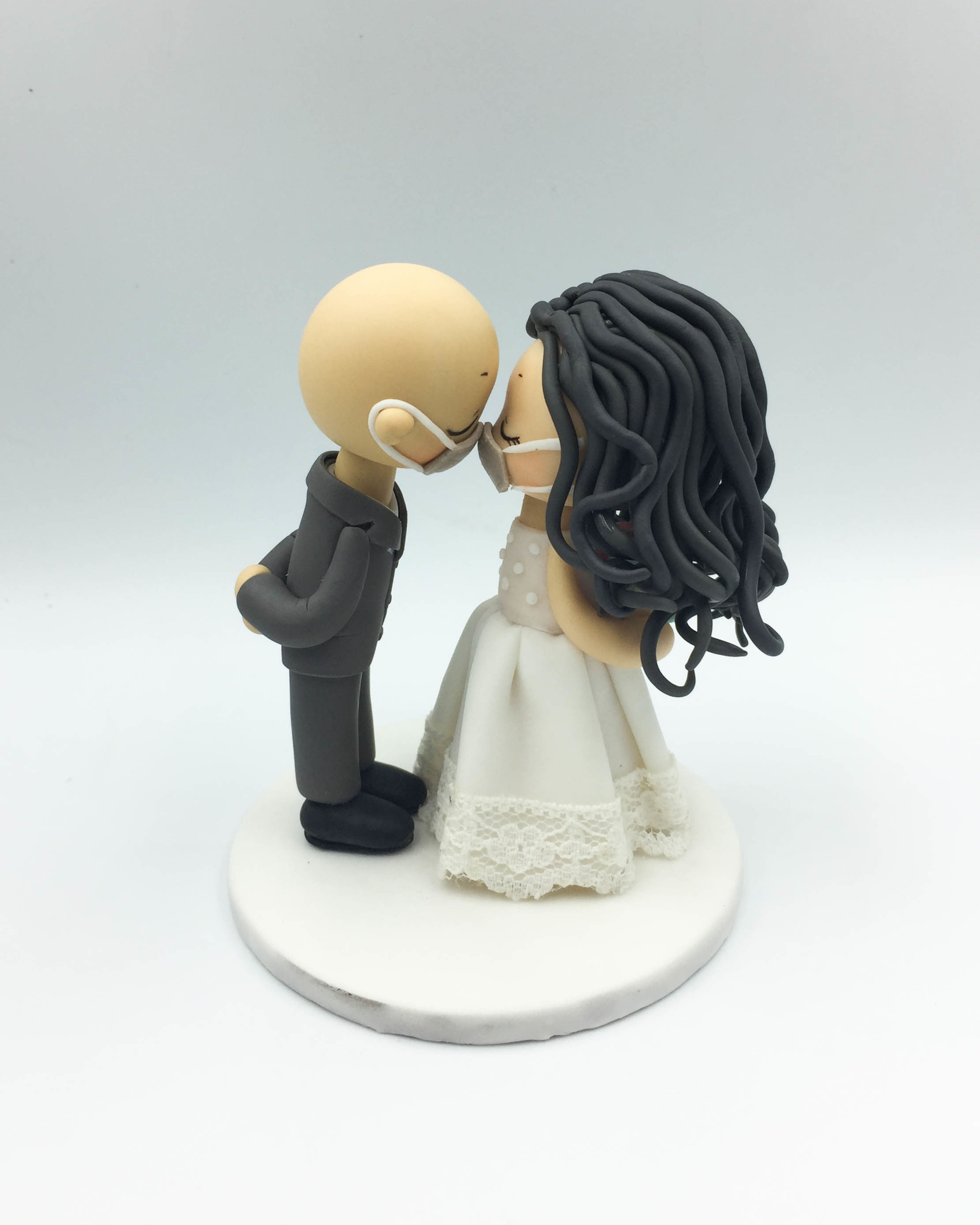 Picture of Bald groom and Curly Hairstyle Bride wedding cake topper