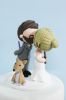 Picture of Harry Potter & Star Wars wedding cake topper, bride & groom with dog cake topper