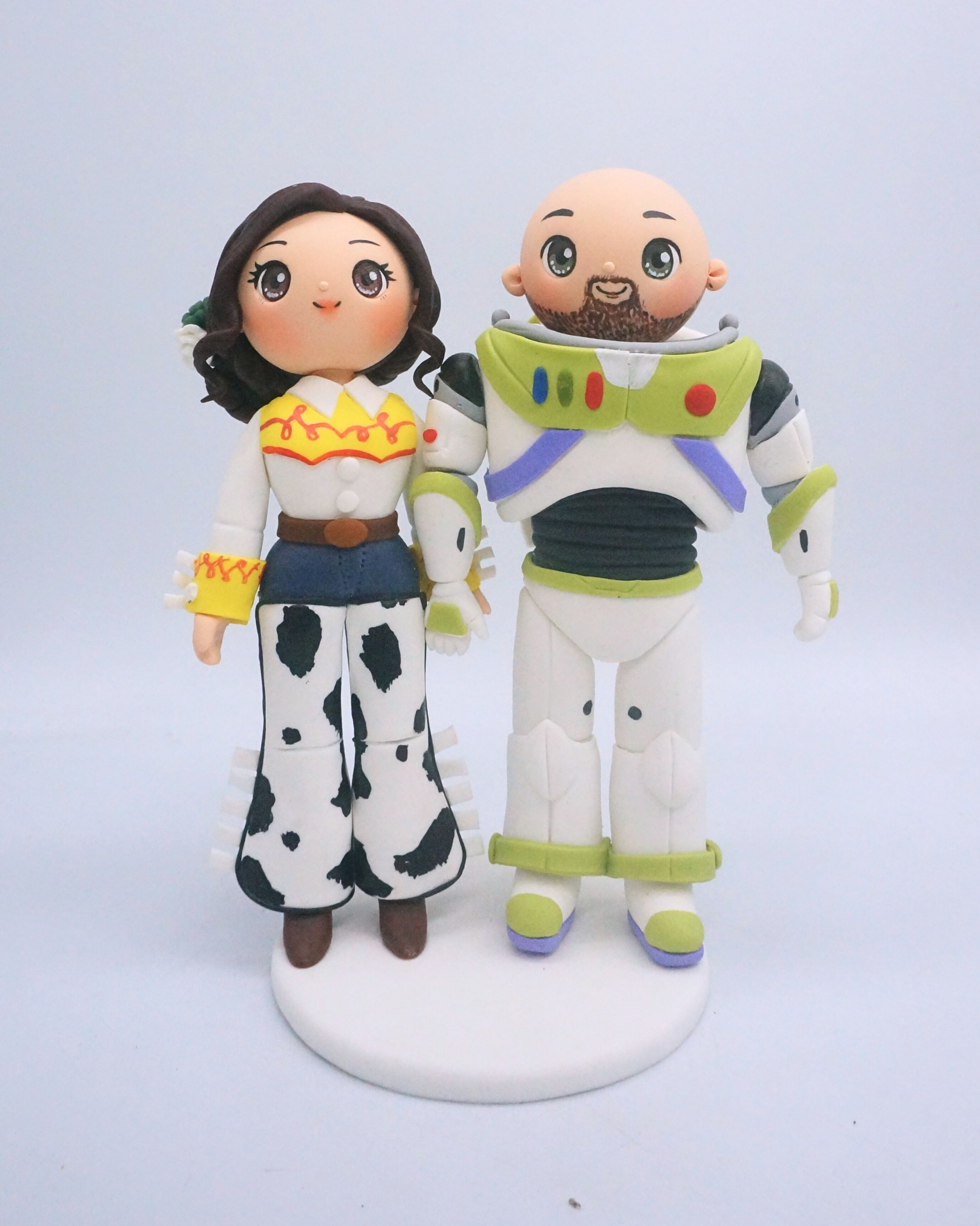 Picture of Toy Story Wedding Cake Topper,  Buzz Lightyear & Jessie Bride Groom Cake Topper