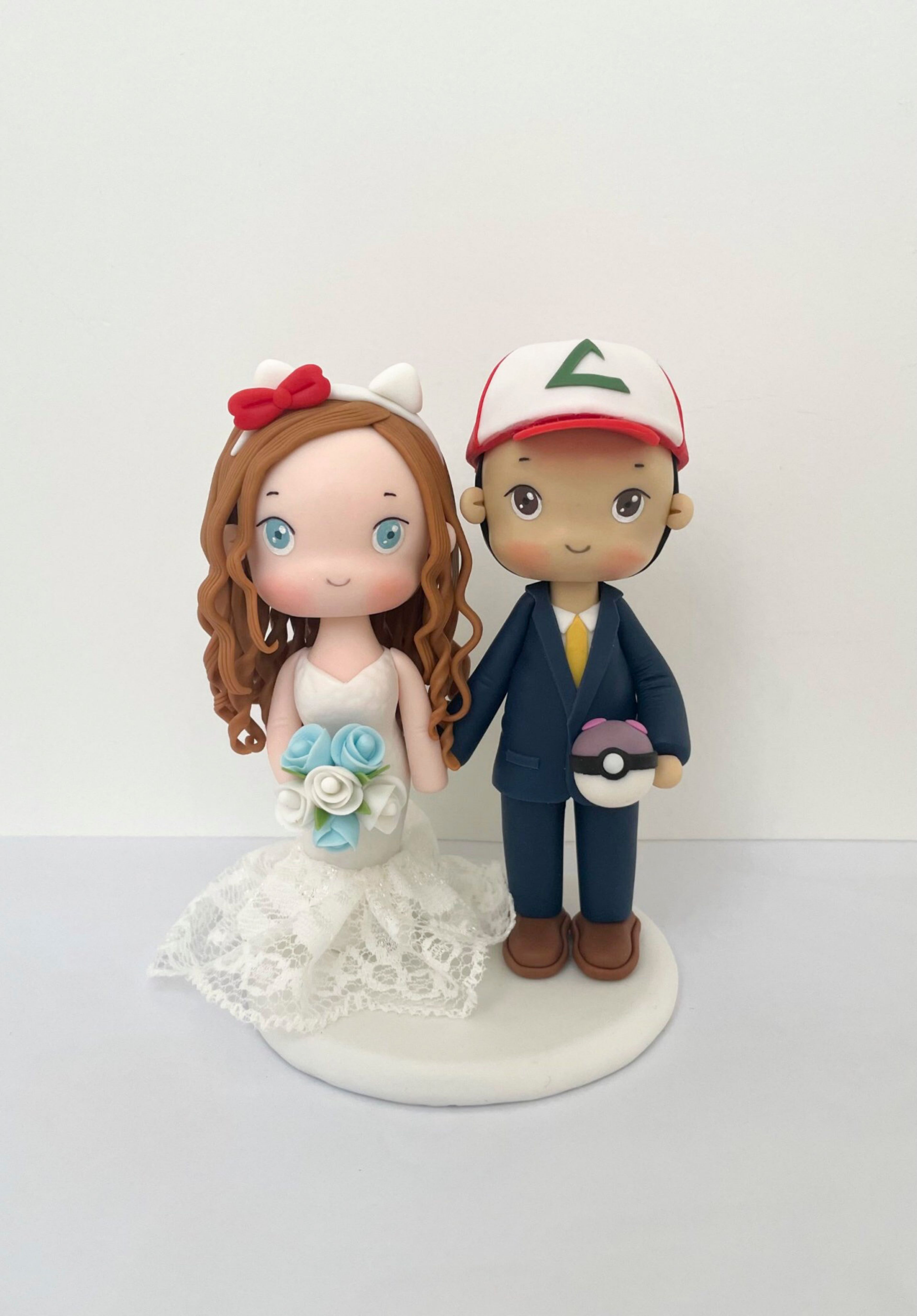 Picture of Pokemon & Hello Kitty Wedding Cake Topper, Ash Groom & Hello Kitty Bride Clay Figurine