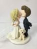 Picture of Kissing bride & Groom with a dog wedding cake topper, Dainty Crown & Sparkling Dress bride,  Side swept groom topper