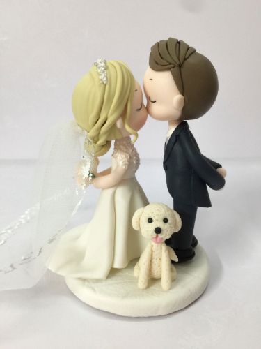 Picture of Kissing bride & Groom with a dog wedding cake topper, Dainty Crown & Sparkling Dress bride,  Side swept groom topper