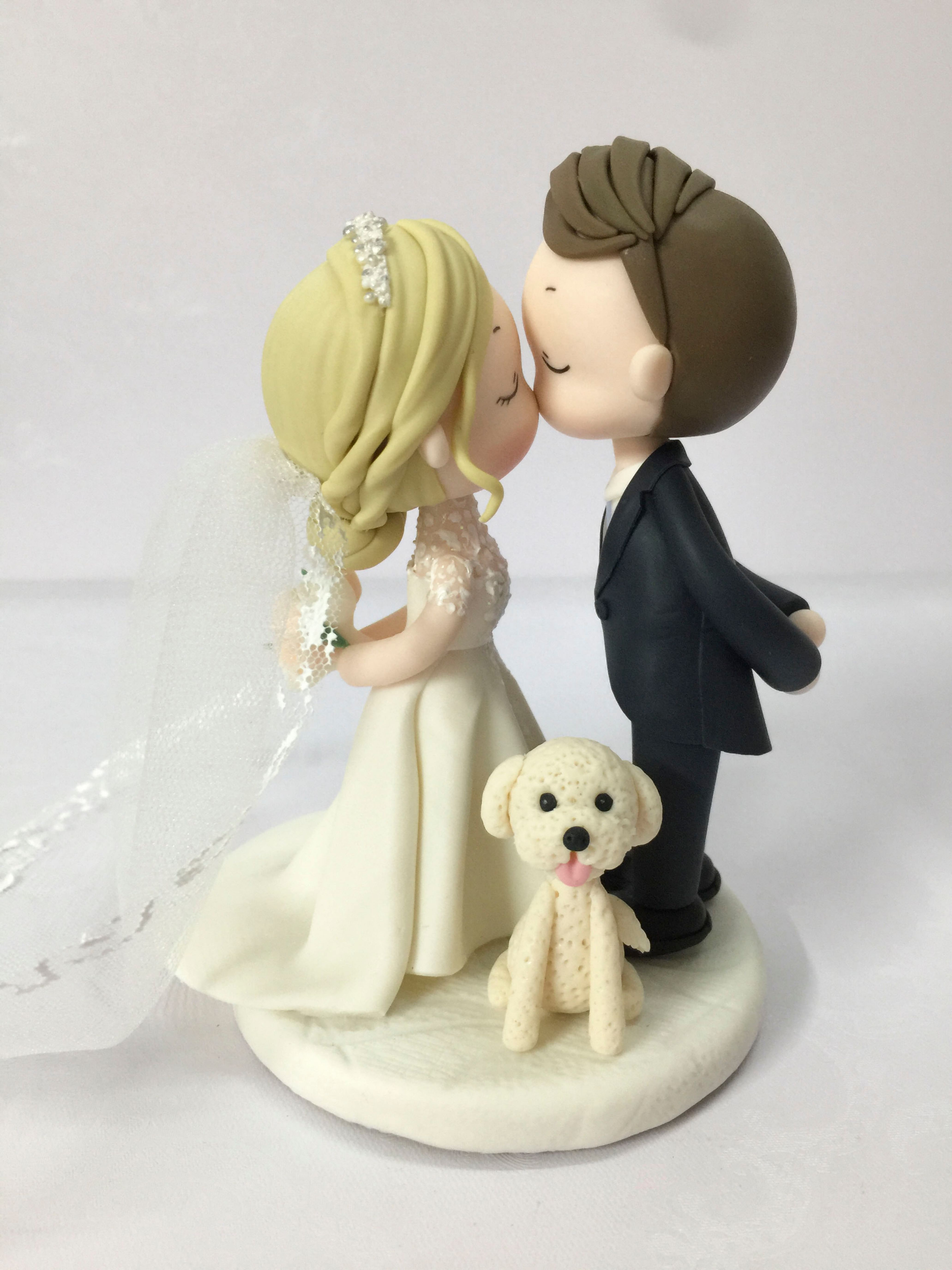 Picture of Kissing bride & Groom with a dog wedding cake topper, Dainty Crown & Sparkling Dress bride,  Side swept groom topper